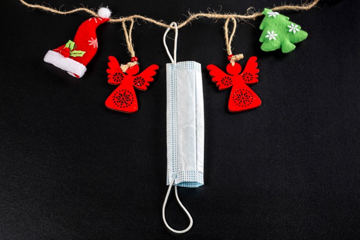 Christmas decorations and face mask on string
