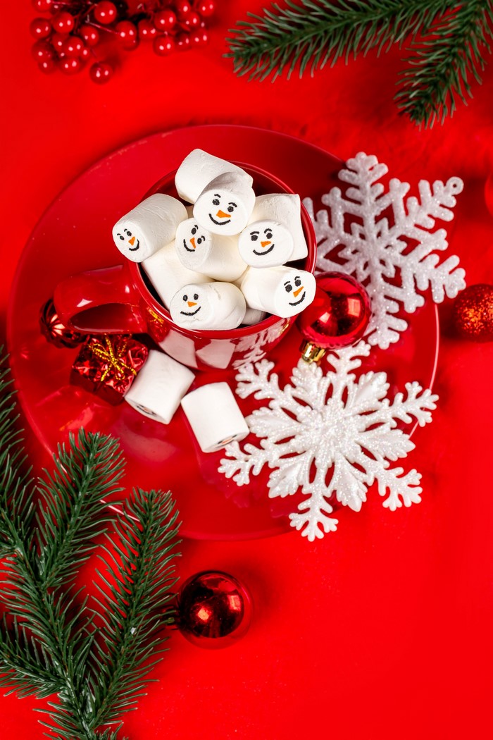 Christmas marshmallows in a mug with snowflakes and ornaments