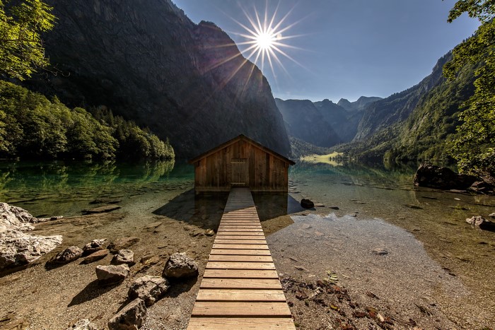 Wooden boathouse on a lake in the Bavarian Alps, Germany