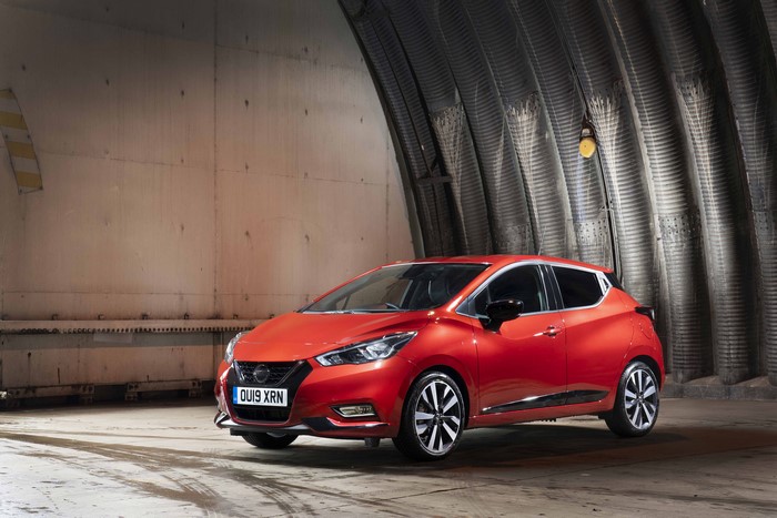 Red 2019 Nissan Micra in a hangar