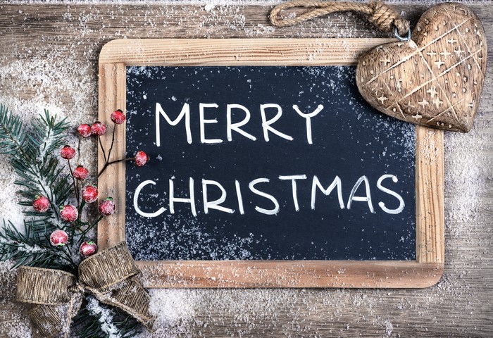 Merry Christmas chalkboard with festive decorations