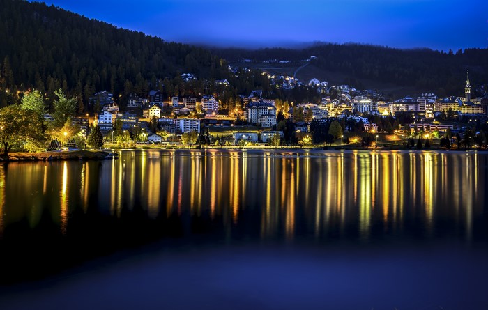 St. Moritz, Switzerland at night with lake reflections