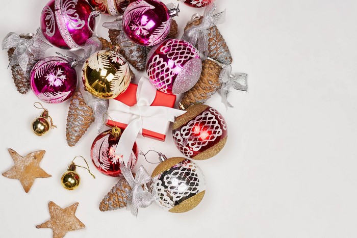 Christmas ornaments, pine cones, gift box, and cookies