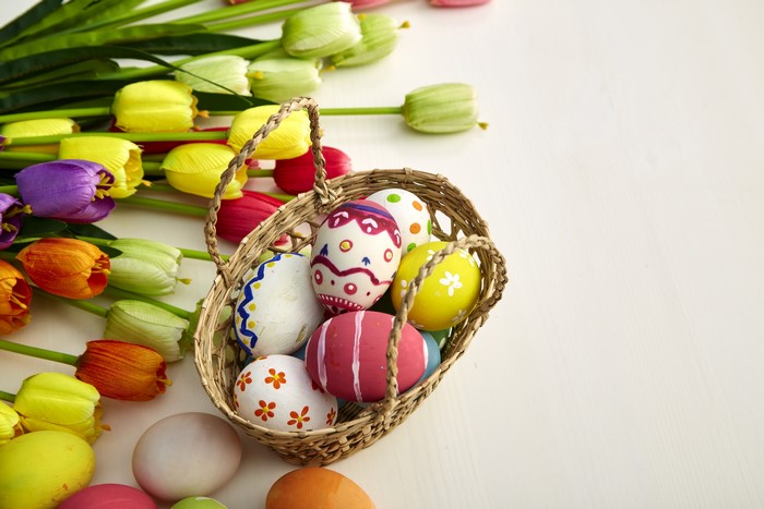 Easter Tulips and Decorated Eggs in Wicker Basket