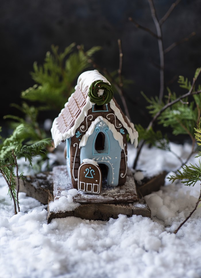 Gingerbread house decorated for Christmas in snow