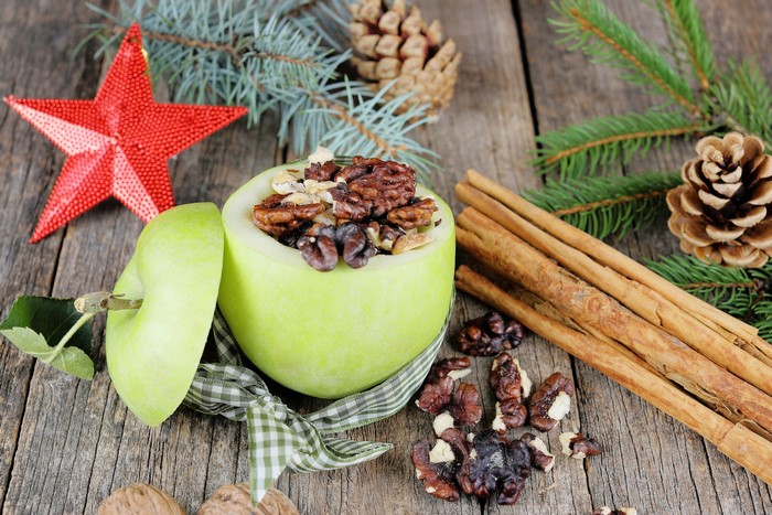 Christmas apple stuffed with nuts and cinnamon sticks
