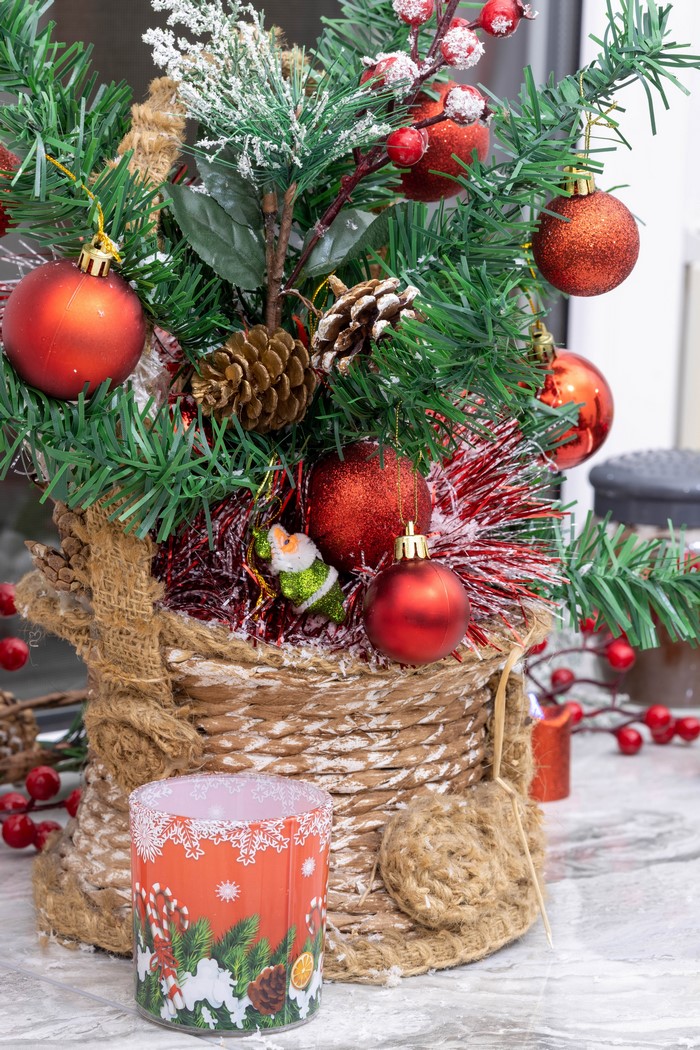 Christmas tree with red ornaments and pine cones