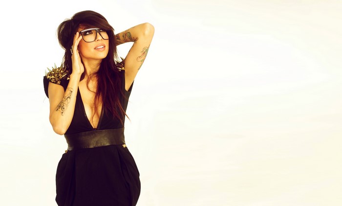 Alie Layus with glasses and tattoos