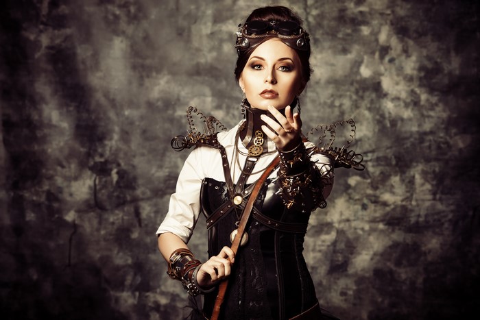 Steampunk woman with goggles and gears