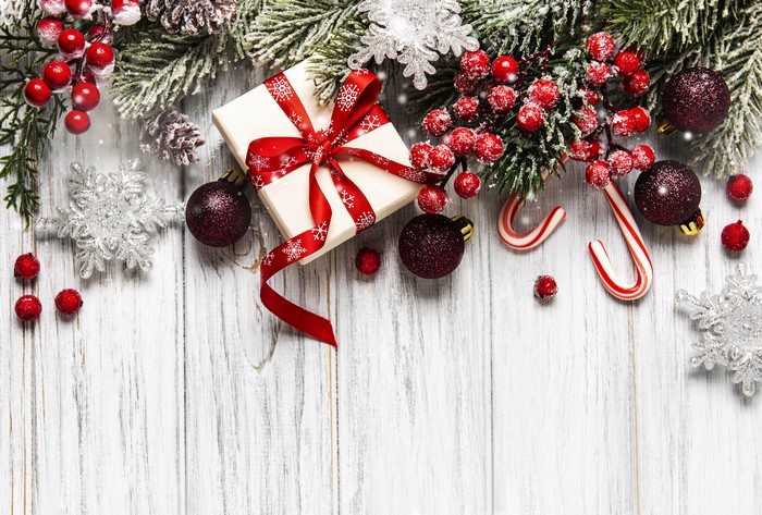 Christmas gift box with berries and ornaments