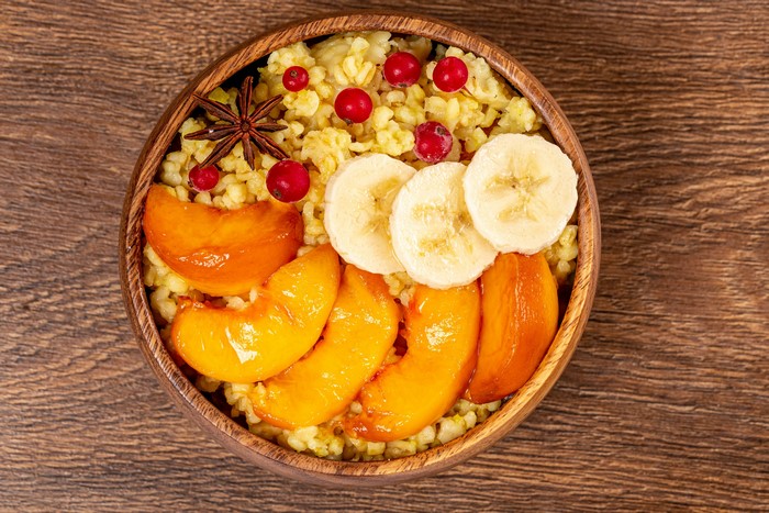 Porridge with Peaches, Bananas, and Berries