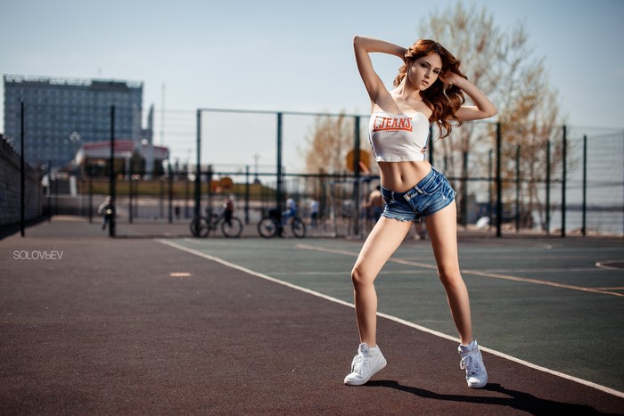 Ksenia Wegner in denim shorts and white top