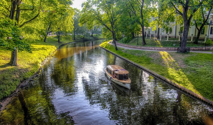 Motorboat on a canal in Riga, Latvia