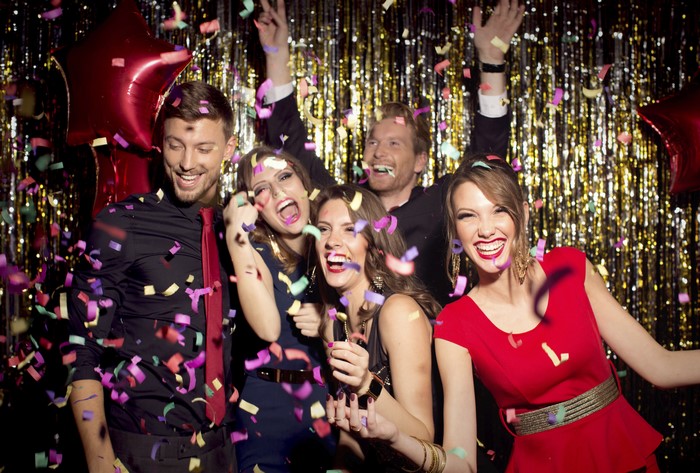 People celebrating with confetti and balloons