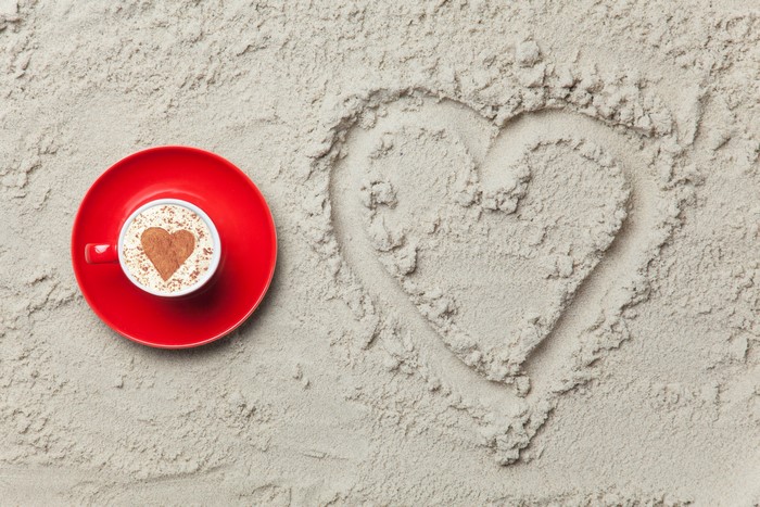 Cappuccino with Heart Shape on Sand