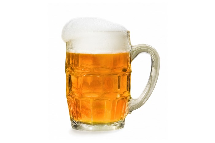 Beer in a glass mug with foam