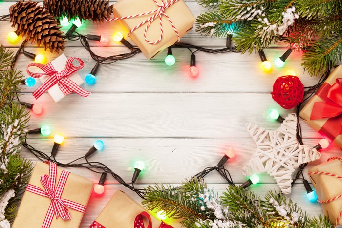 Christmas Gifts and Lights on Wooden Table