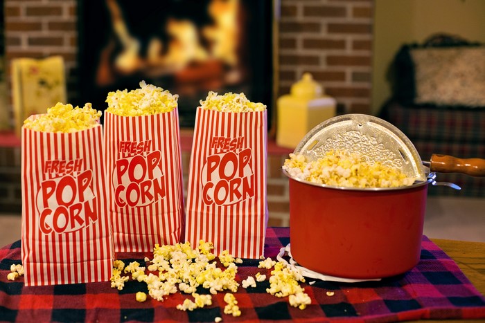 Popcorn bags and popcorn maker by fireplace