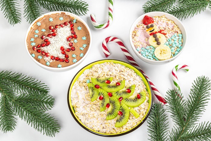 Christmas themed oatmeal bowls with fruit and candy canes