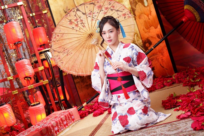 Woman in Kimono Holding Umbrella with Lanterns