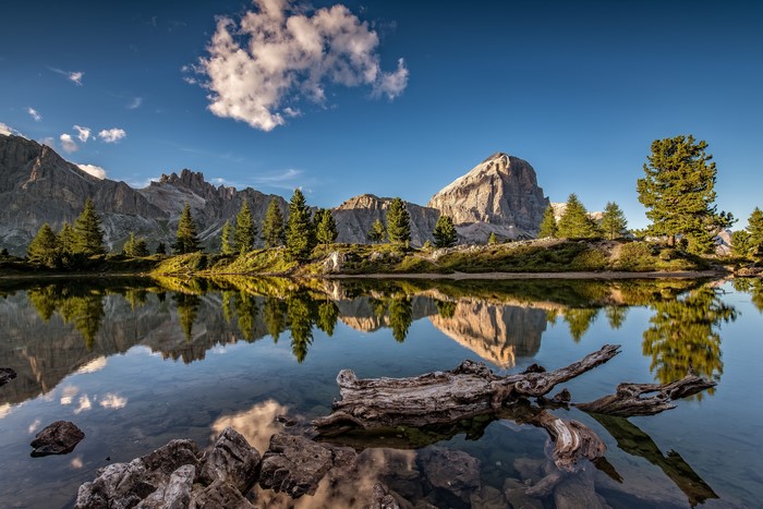 Lake reflection of Dolomites mountains in Italy