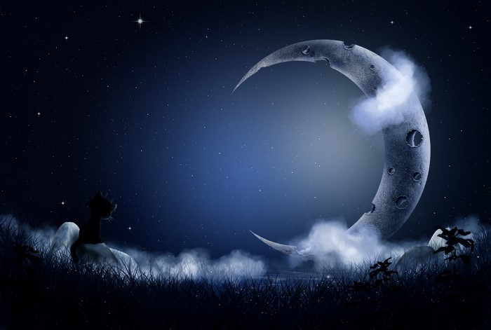 Crescent moon in a starry night sky with clouds