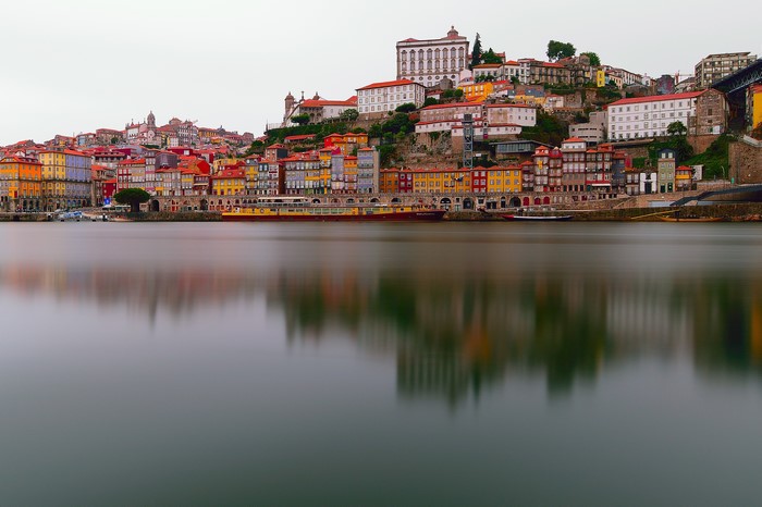 Colorful buildings on a hill overlooking a river in Porto, Portugal