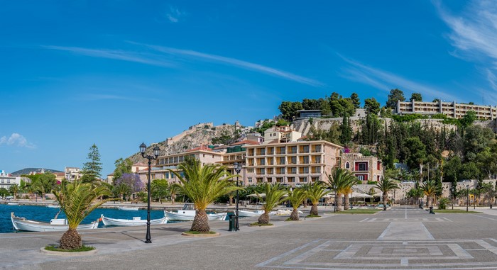 Nafplio, Greece waterfront with Acronauplia fortress and palm trees