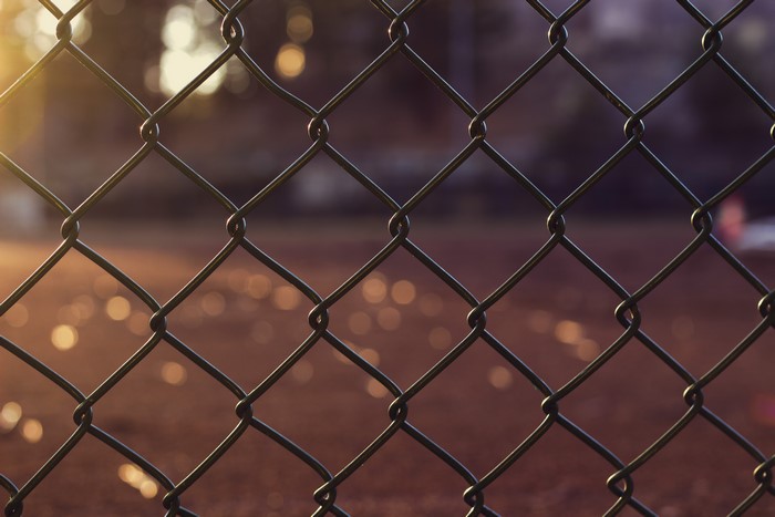 Chain-link fence with bokeh background