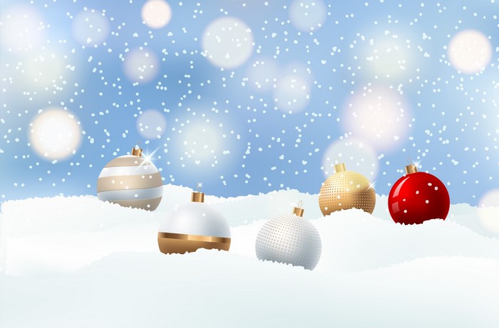 Christmas ornaments in snow with bokeh