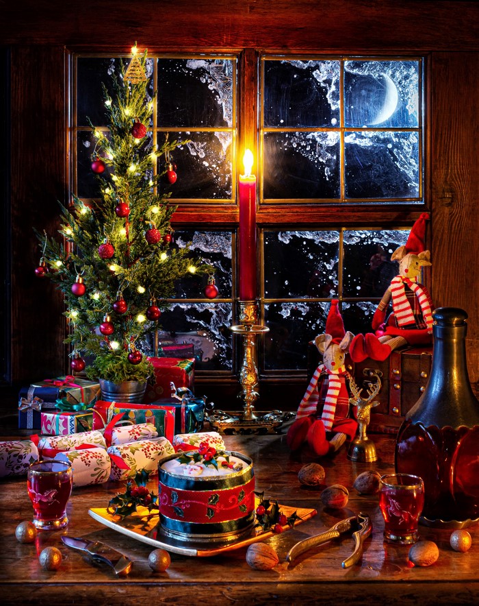 Christmas still-life with tree, gifts, and window view