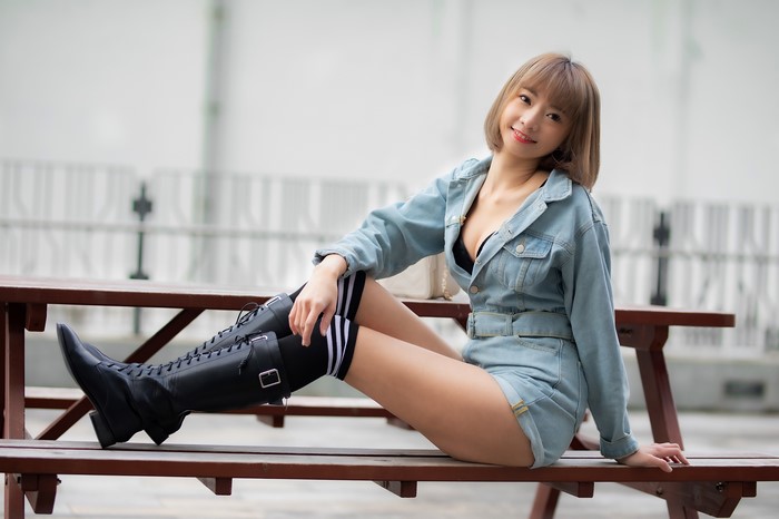 4K Asian Woman Sitting Wearing Knee High Boots