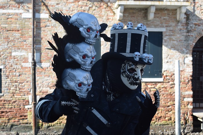 Person in Skull Mask and Hat at Carnival
