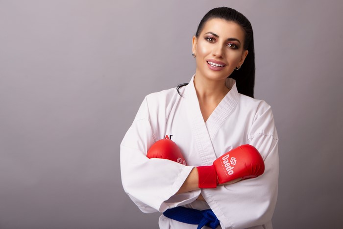 Woman in Karate Gi with Red Gloves
