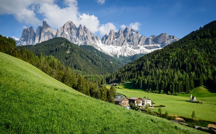 Dolomites Mountains in Italy with Green Grasslands