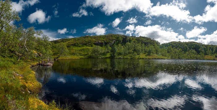 Holmevatn Lake in Norway with Clouds and Reflection