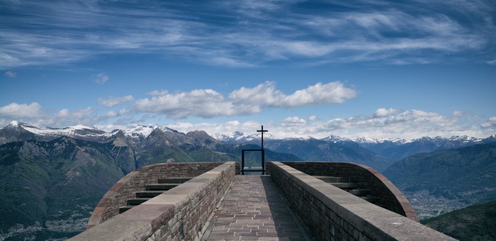Cross on a viewpoint overlooking the Alps in Switzerland