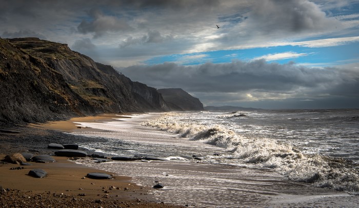 Charmouth Beach England Coast with Waves and Clouds
