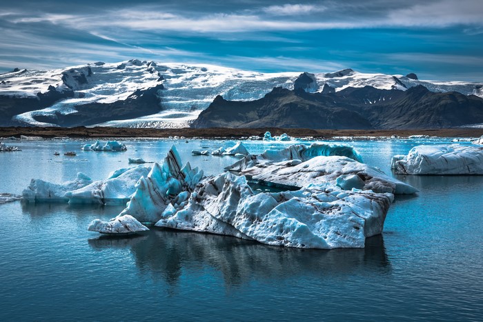 Icebergs in a lake with mountains in Iceland