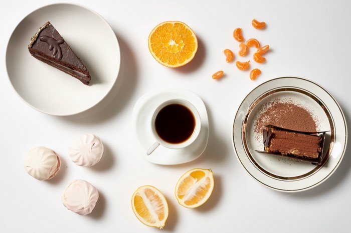 Chocolate cakes with coffee and fruits