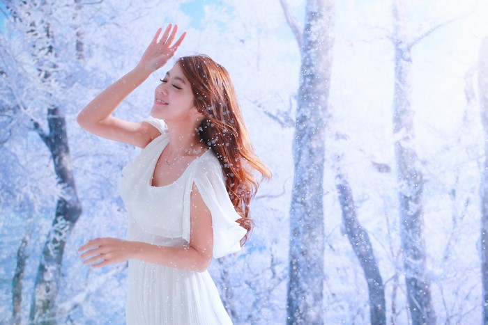 4K Asian Woman Smiling in Snowy Forest