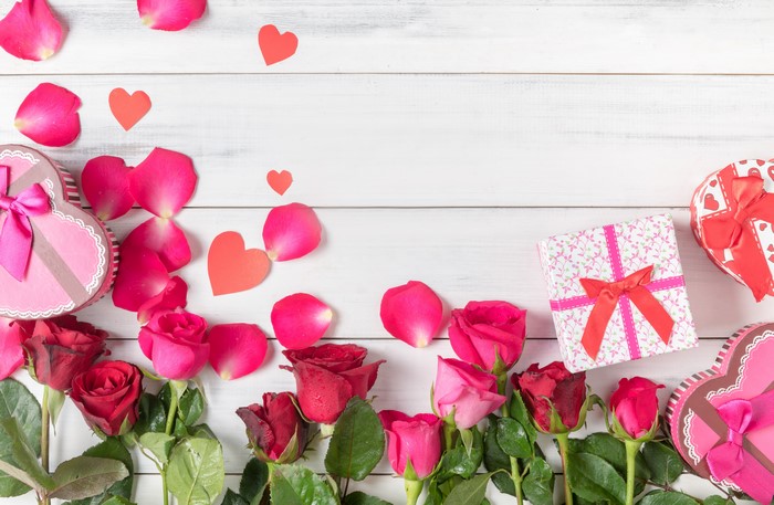 Roses, Petals, and Gifts on Wood Planks