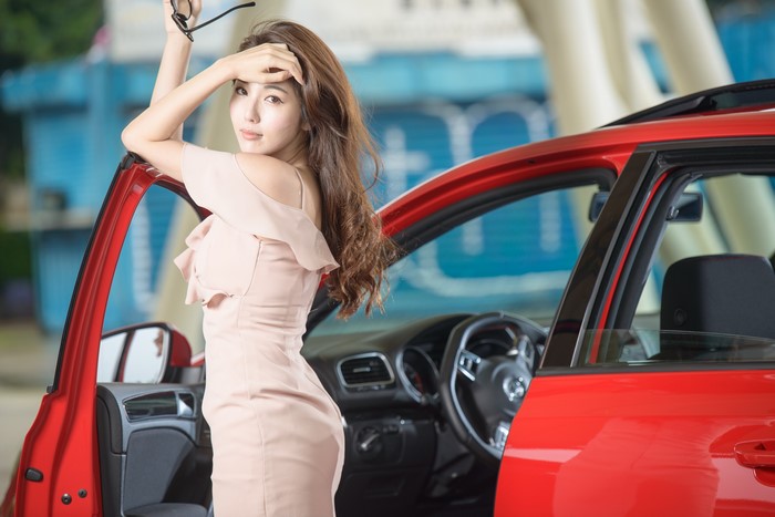 4K Asian Woman in Pink Dress by Red Car