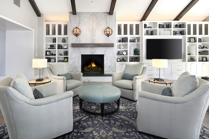 Living room with fireplace and armchairs
