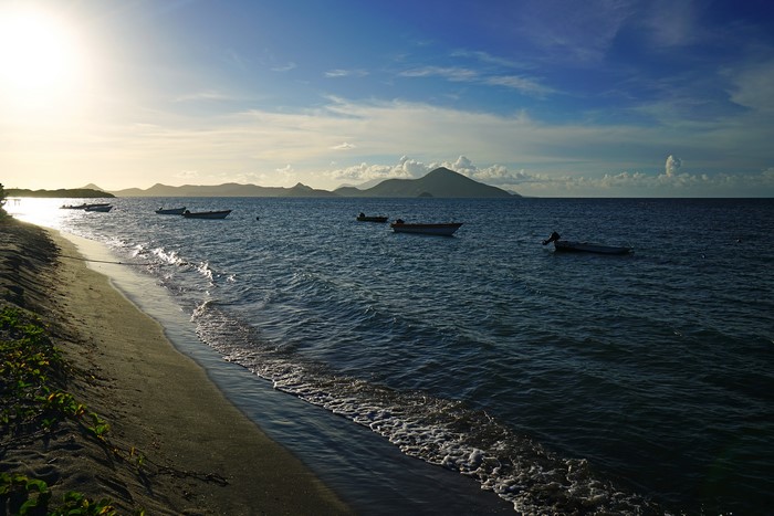 Boats on the sea near Nevis coast at evening