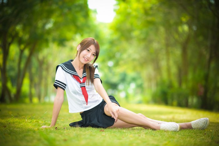 4K Asian Schoolgirl Sitting on Grass