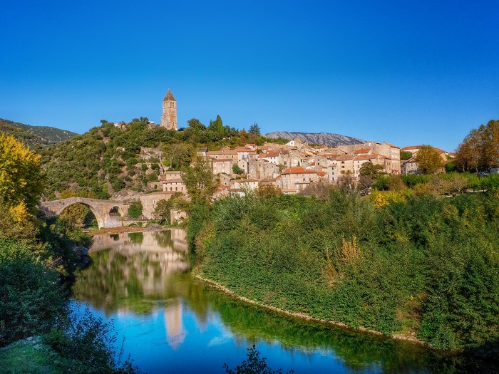 Olargues village with bridge and river in France