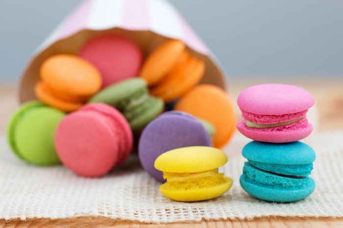 Macarons in a striped paper cone