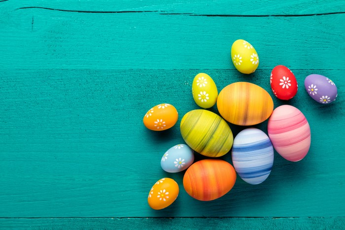 Easter Eggs on Teal Wooden Background