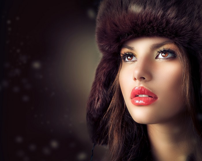 Woman in fur hat with red lips